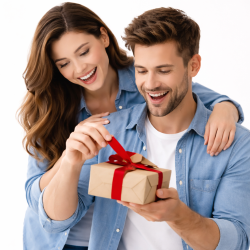 Boyfriend_opening_a_gift_while_girlfriend_hugs_him_from_behind_on_white_background_romantic_gifts_for_boyfriend_in_Dubai