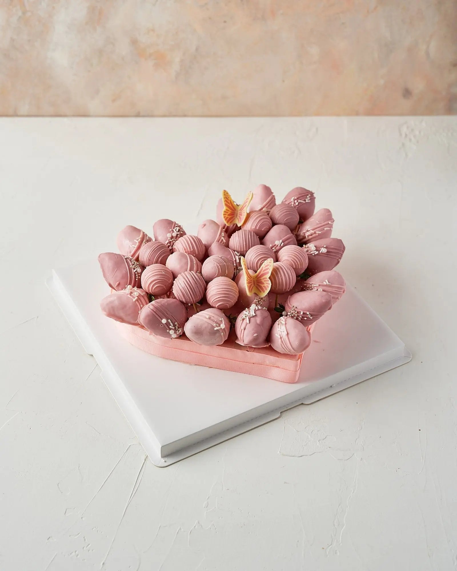 pink-and-purple-chocolate-strawberries-arrangement-dubai