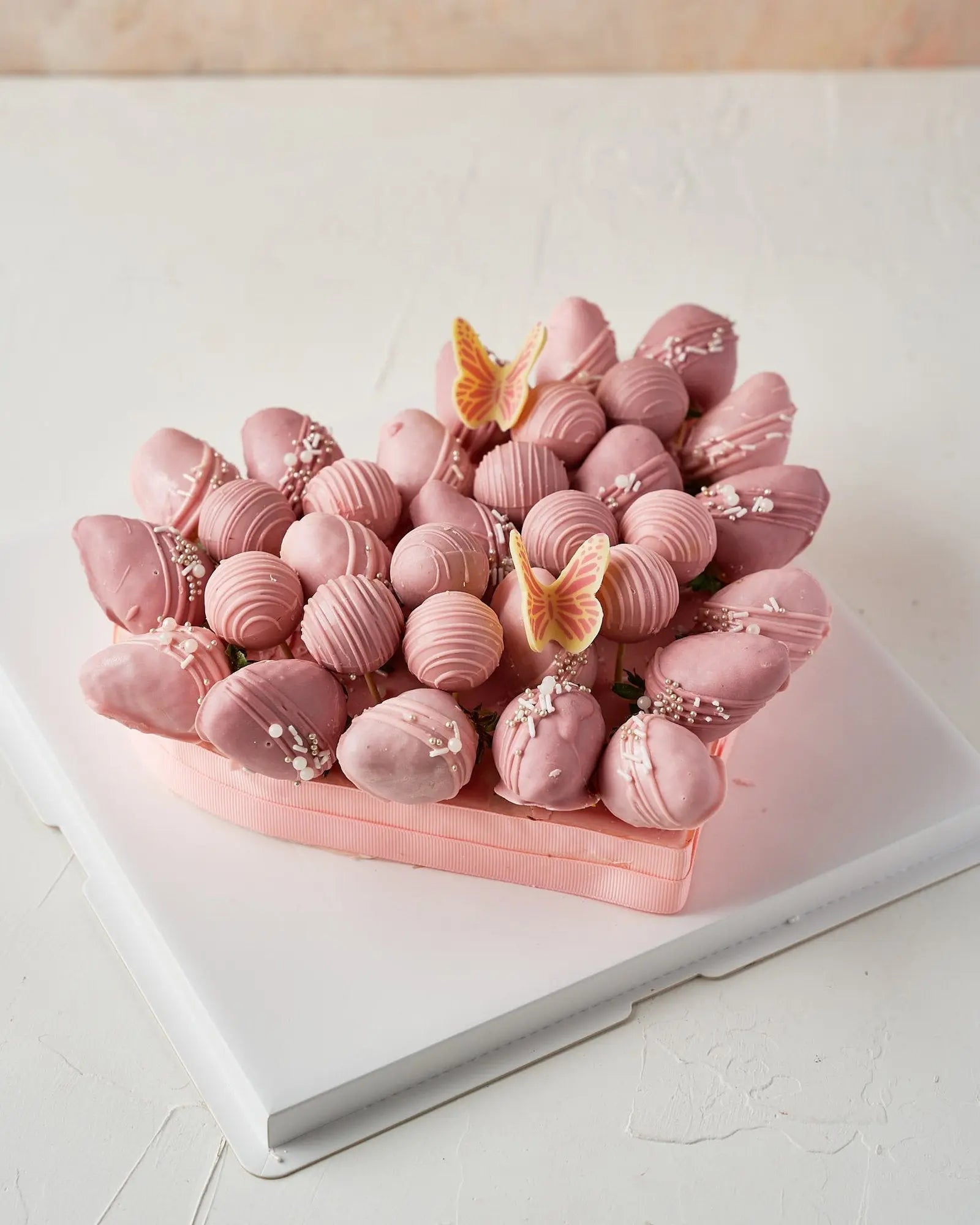 pink-and-purple-chocolate-strawberries-arrangement-dubai