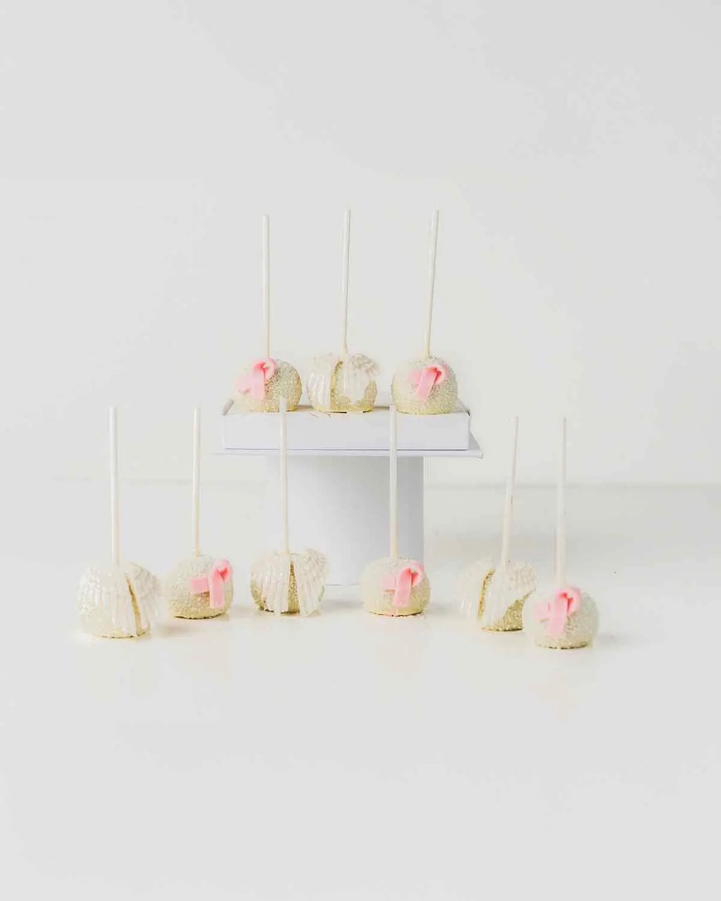 bow-and-wings-white-chocolate-cake-pops-dubai