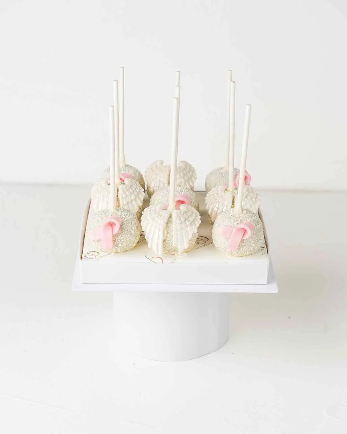 bow-and-wings-white-chocolate-cake-pops-dubai