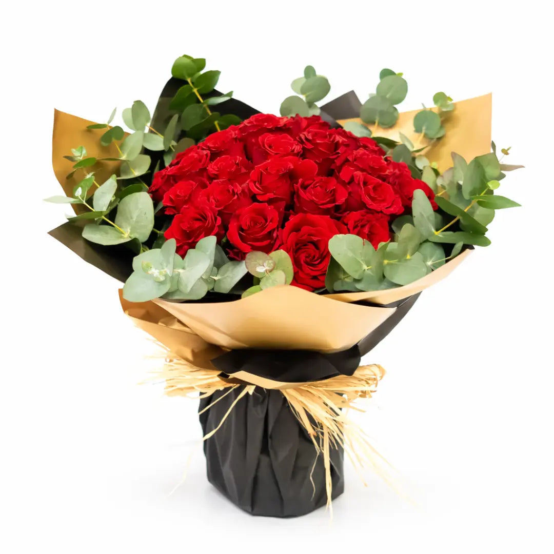 RedrosebouquetwitheucalyptuswrappedinredandgoldpaperforsamedayflowerdeliveryinDubai